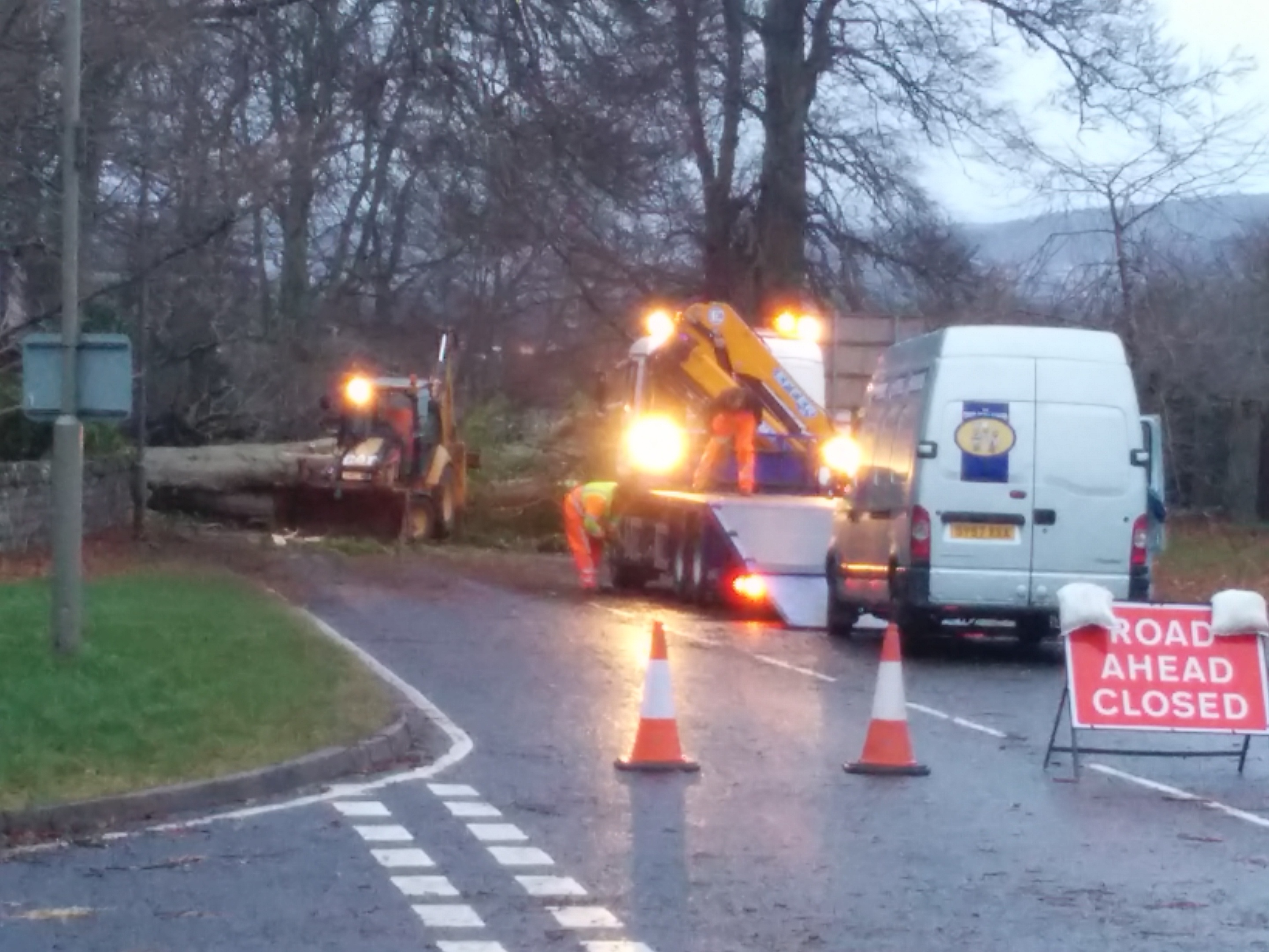 Workers attempt to clear a fallen tree at Culloden Road in Inverness