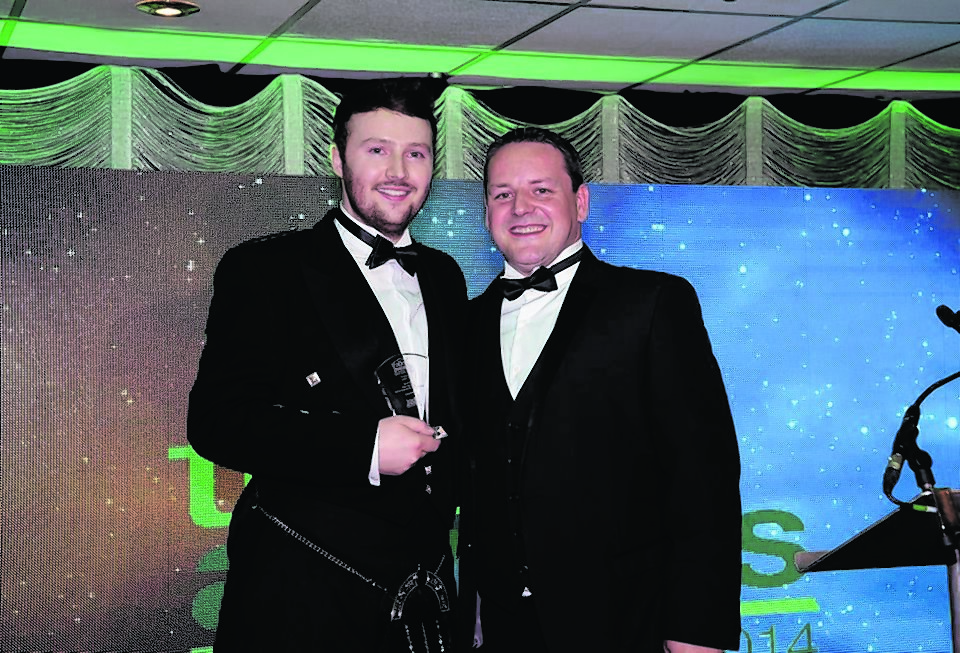 Mark Kennedy (left) and Darren Ross, director at Trades Awards (right). Mark receiving his Tradesman of the Year Award 2014