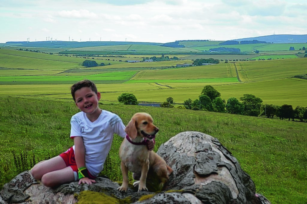 This is Drew enjoying the view with his dog Daisy. They live in Insch.