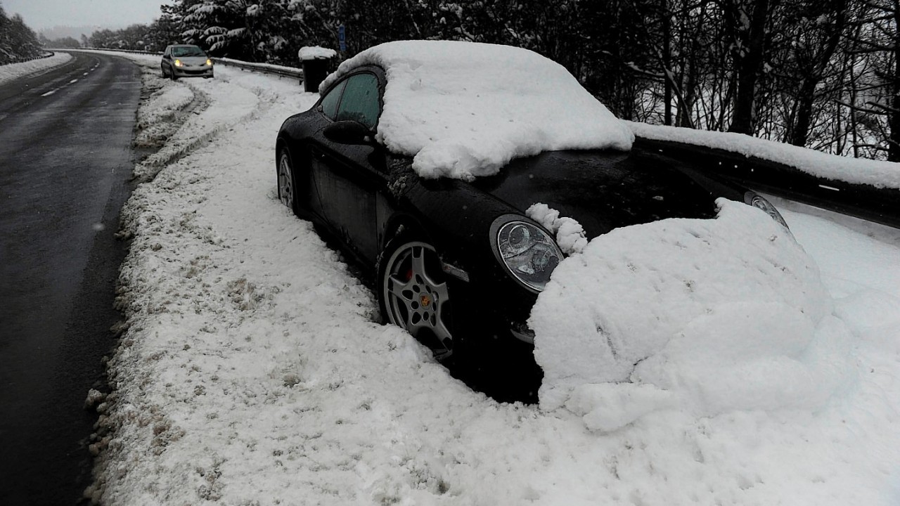The Porsche was left at the Drumochter Pass... and has since been covered in snow
