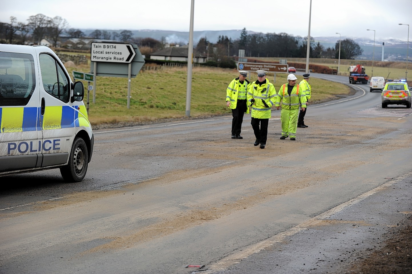 Police at the scene of the A9 crash near Tain