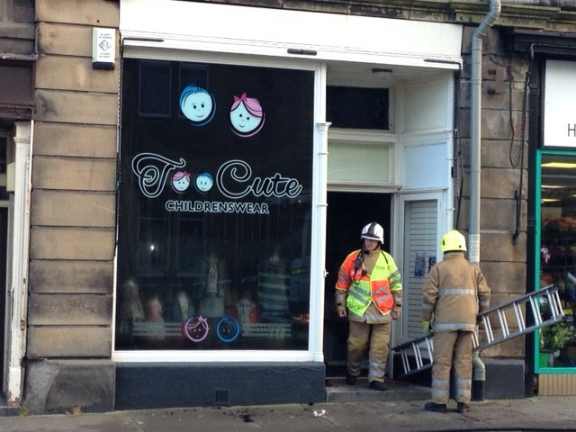 Firefighters at the scene of the  Buckie High Street fire