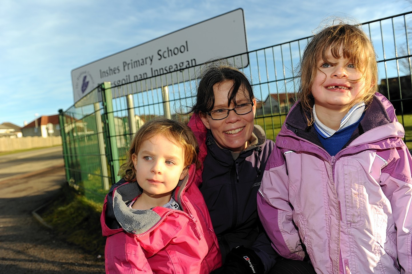 um, Carolyn Cload, centre, with daughters, Hazel and Erica, who are respectively in Nursery and P2 at Inshes Primary School, Inverness.