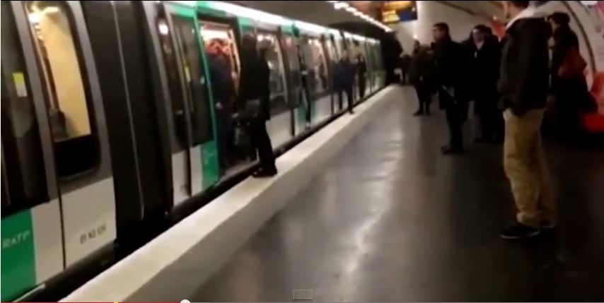 A screen grab of the moment the black man was pushed off the train 