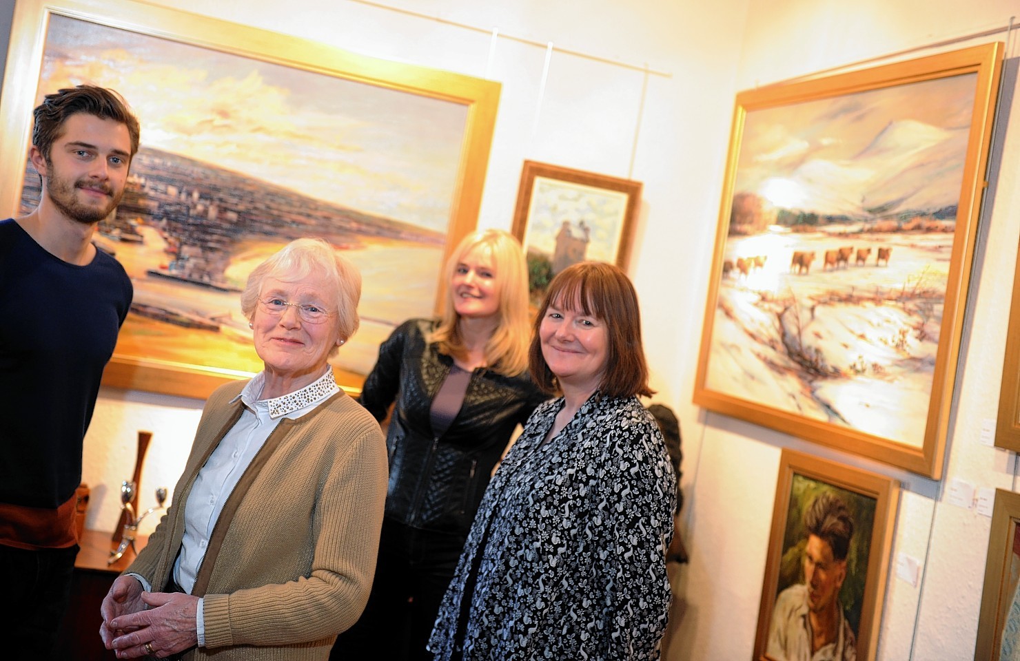 Eric Auld's grandson, wife and two daughters, Glen Smith, Pat Auld, Deirdre Smith  and Catriona Tippin with some of his work on display.      