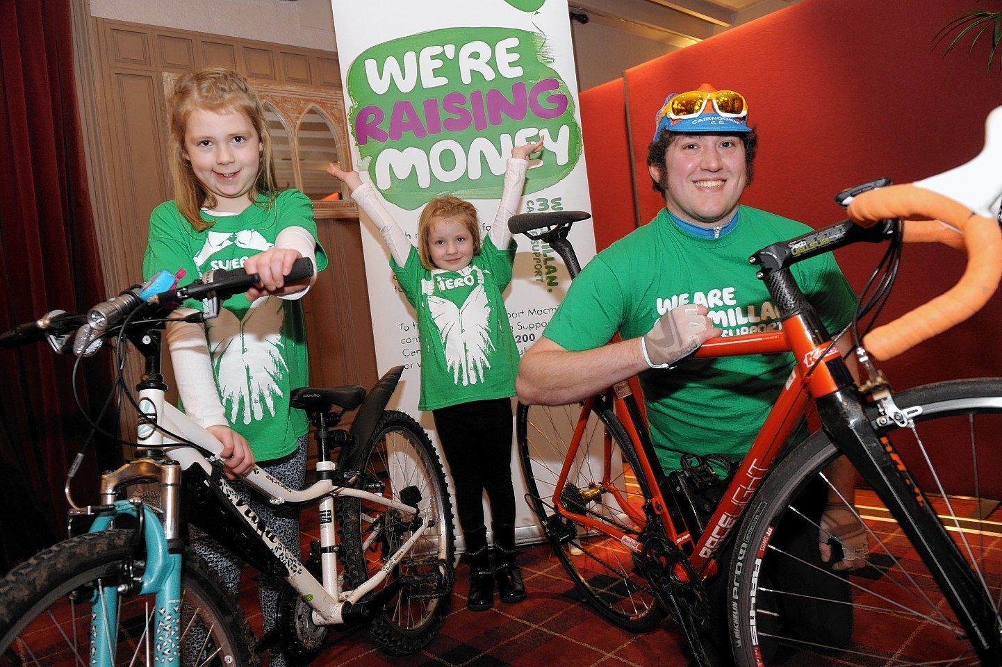 Cyclists Sophia and Ava Henderson with Mark Munro at Alford Rotary Club's cheque handover for the KT Bike Run