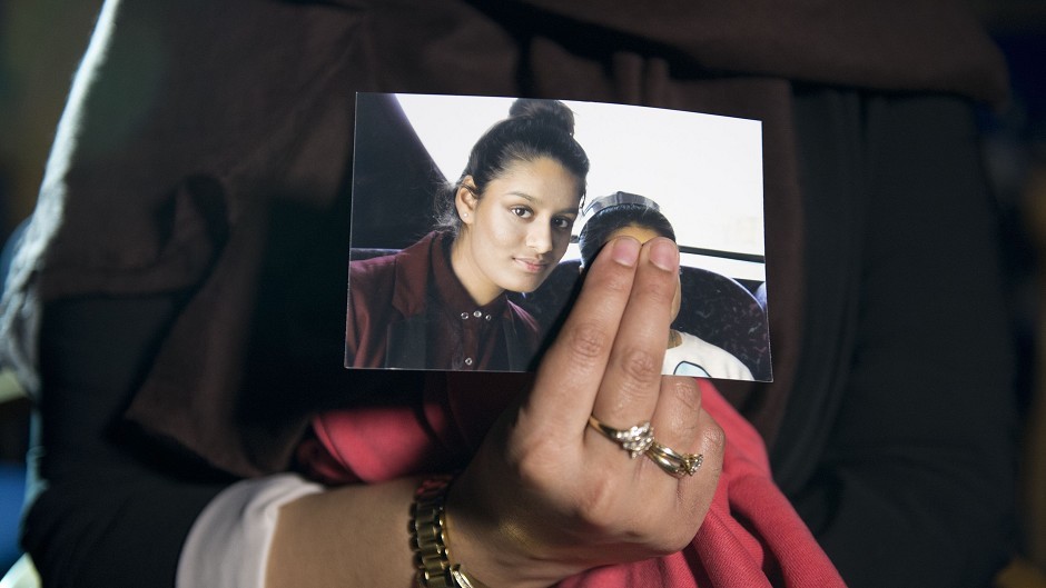 Renu Begum holds a photograph of her younger sister Shamima,