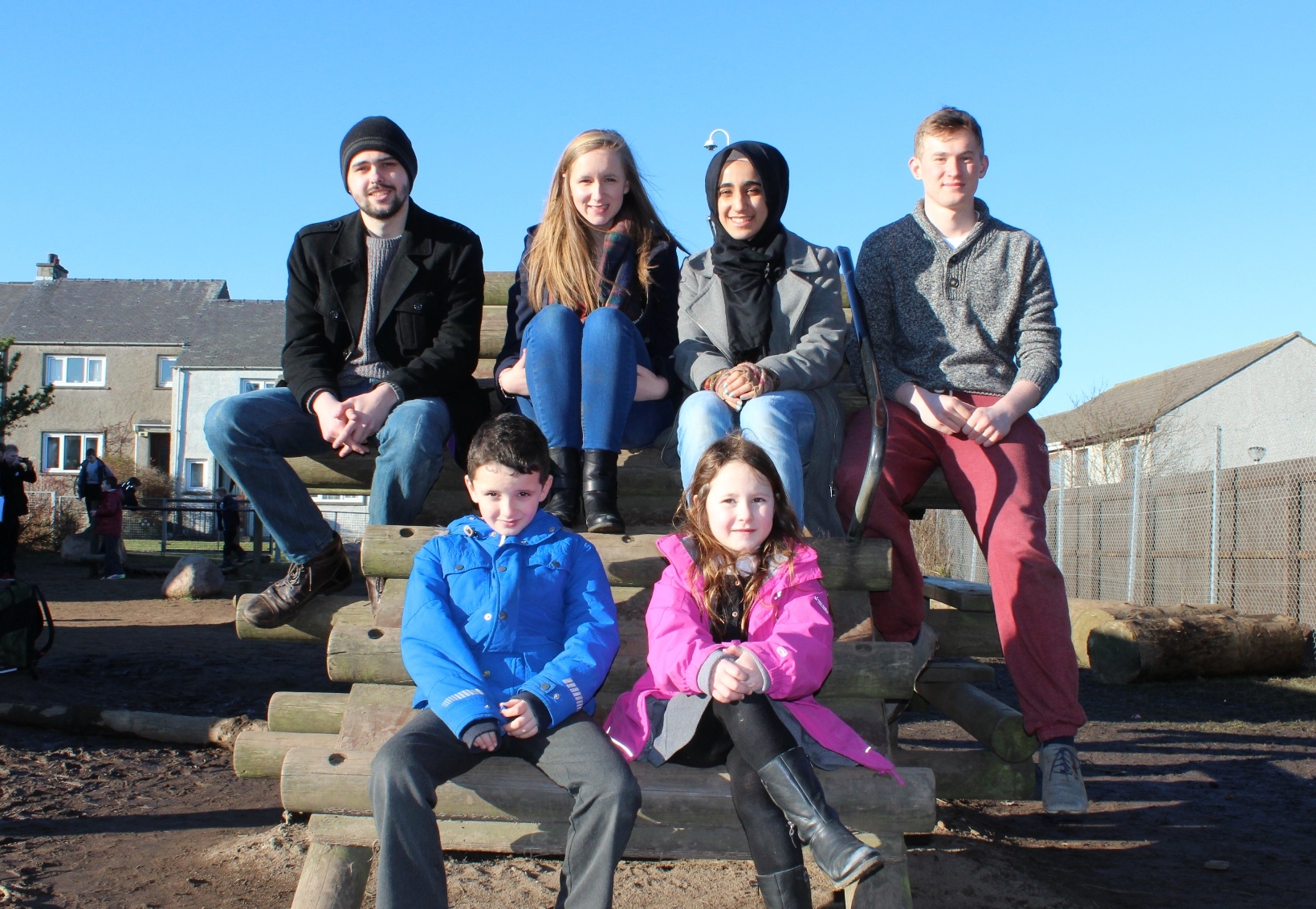 Students David Milne, Sophie Houston, Alaa Beruwien and Tom Perritt, with Portlethen youngsters Euan Brown and Lola McBeath.