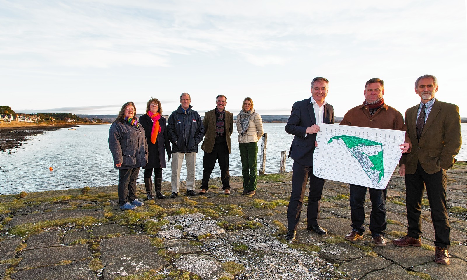  Richard Lochhead with all the Directors of the FINDHORN VILLAGE CONSERVATION COMPANY  FVCC and Extreme right - Dr John Watt, Chair of Scottish Land Fund
