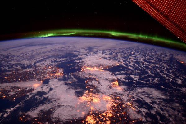 The aurora shielding the earth, as pictured from the ISS