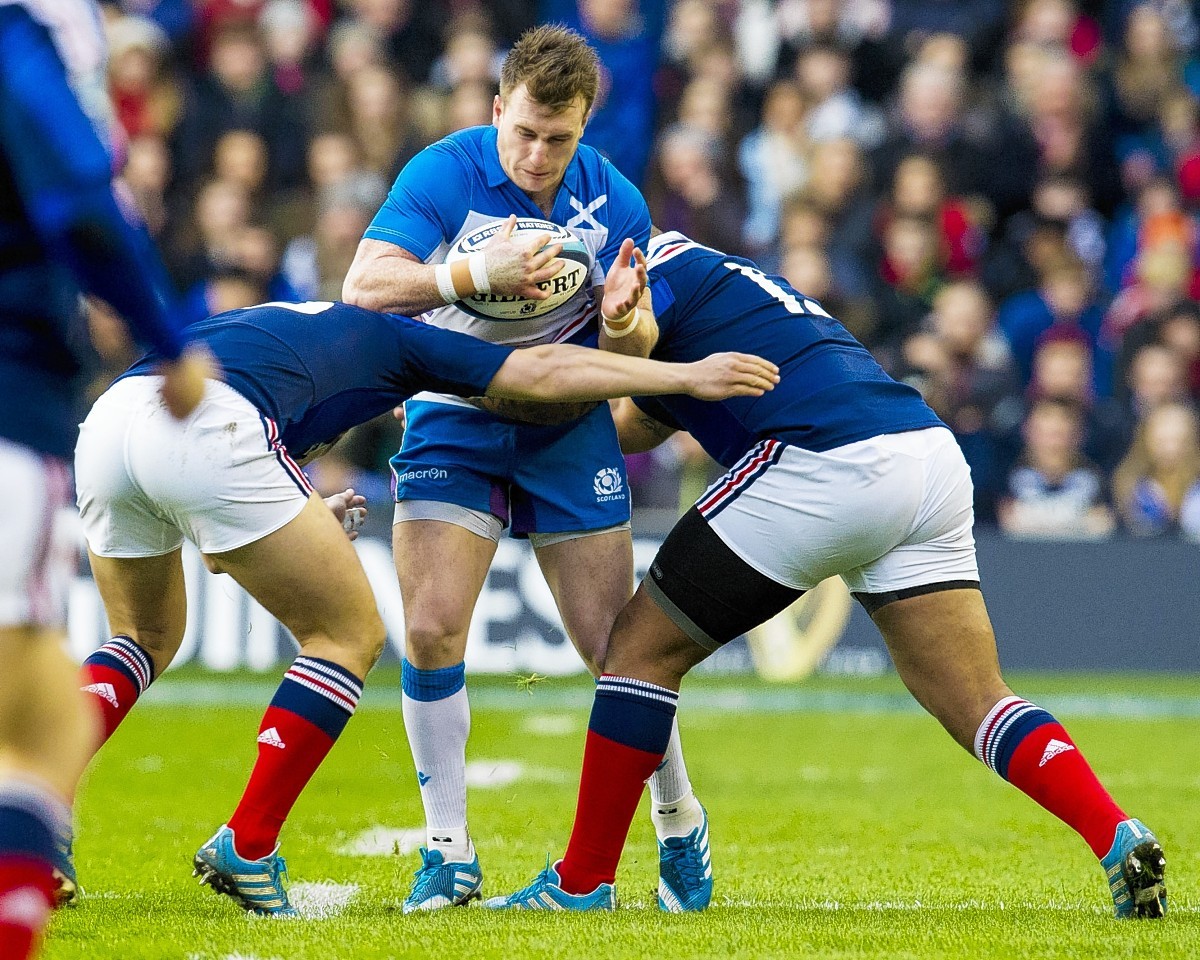 Stuart Hogg is stopped in his tracks by French tackles at Murrayfield last year
