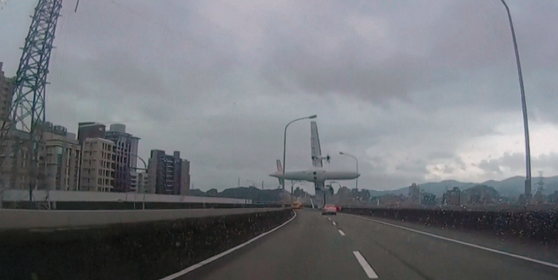 The moment the Taiwanese plane crashed into the motorway