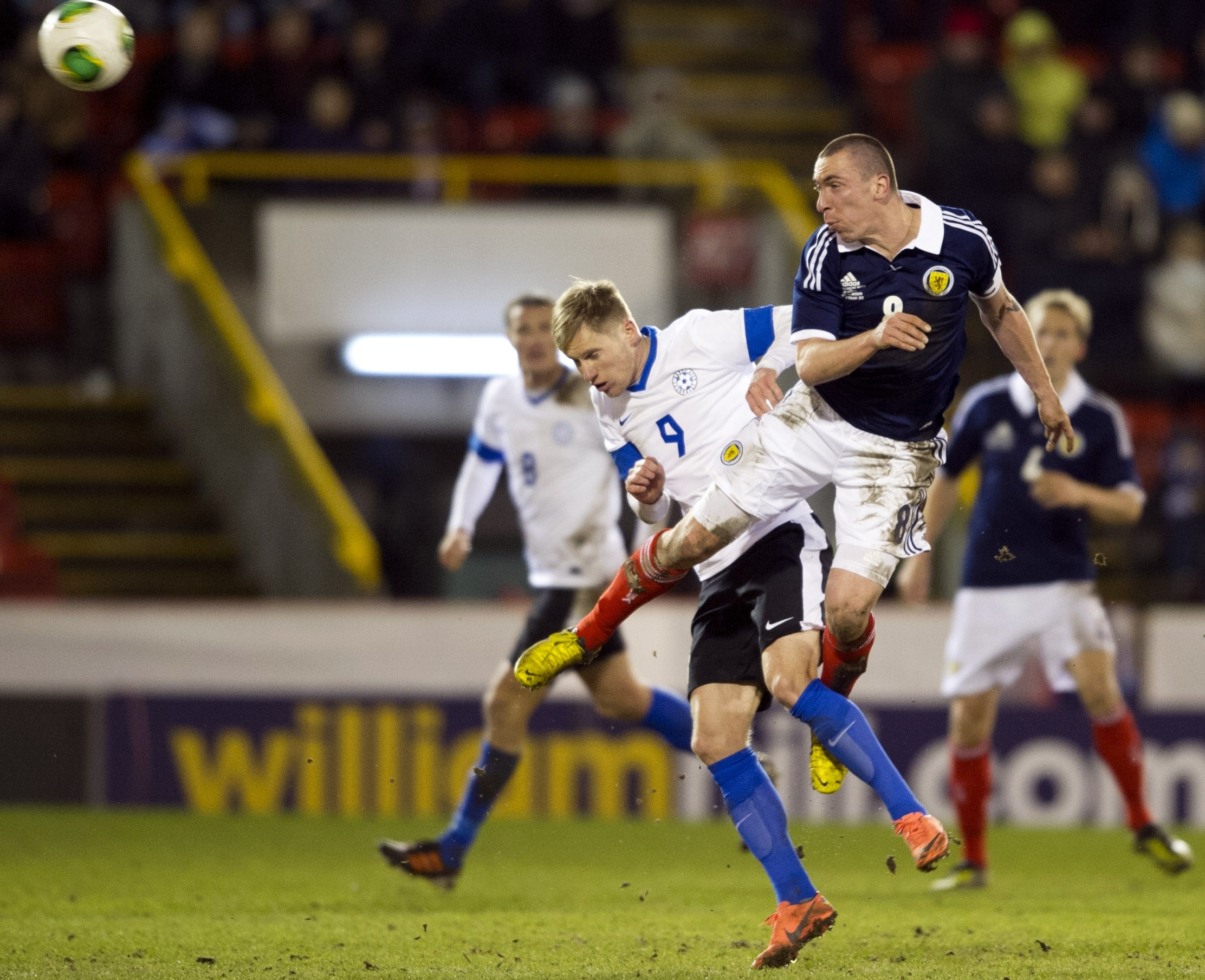Tarmo Kink challenges Scott Brown for a header when Estonia played Scotland at Pittodrie
