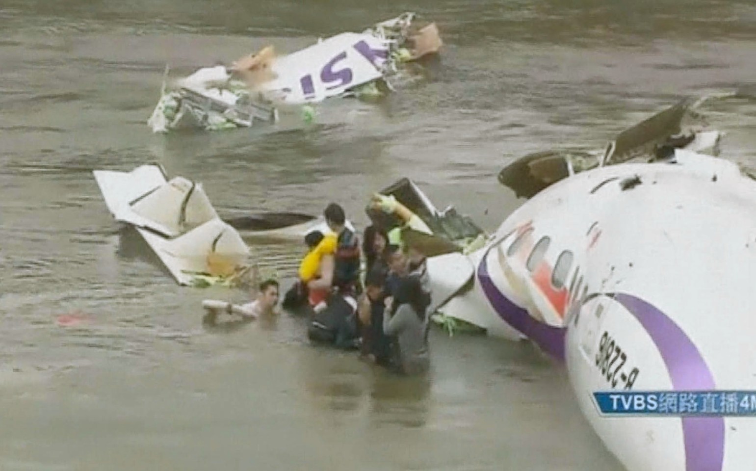 The child is rescued from the plane after it crashed into the river