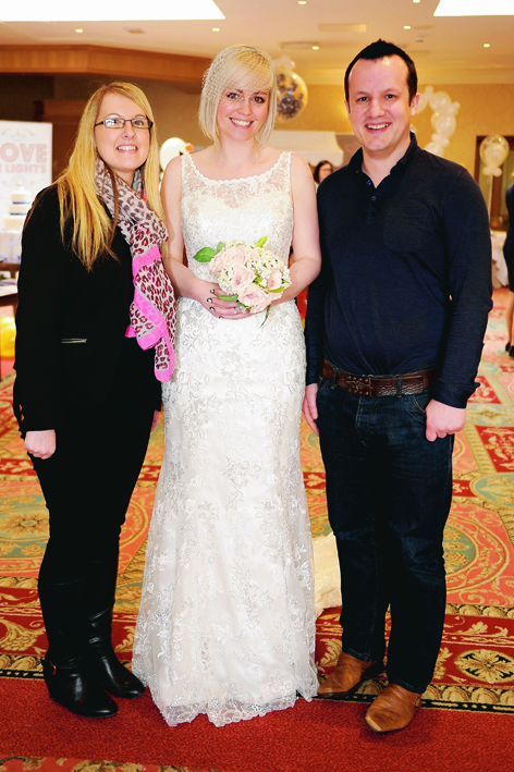 Katrina Laird, of Wedding Belles (centre) with Georgina Quin and her fiancee Martin Cumming