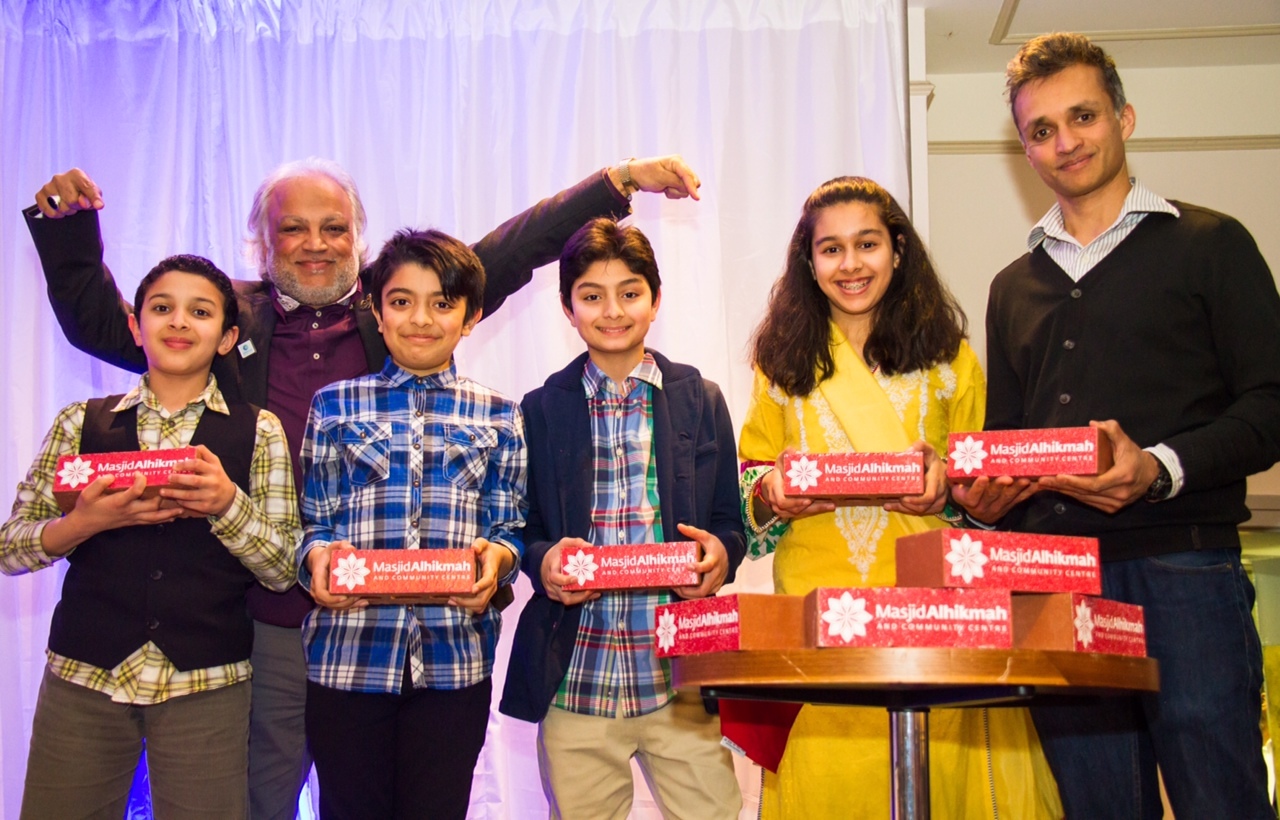 Architect Shahed Saleem (right) and fundraising event host Habib Malik with some of the children who will get the chance to lay bricks in the foundations of the Masjid Alhikmah