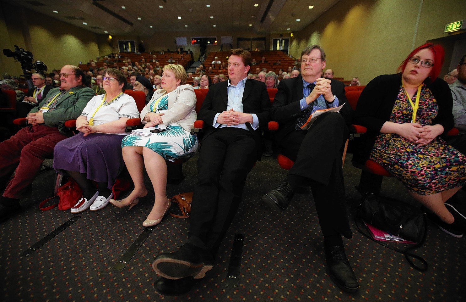 Danny Alexander listens in at the party conference yesterday