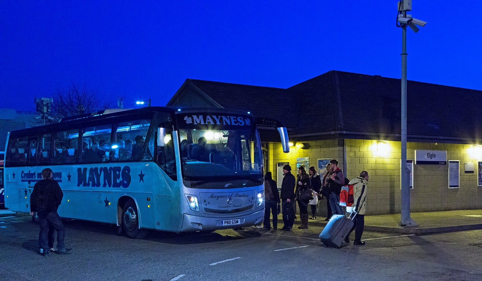 Passengers at Elgin Train Station are transferred onto a bus