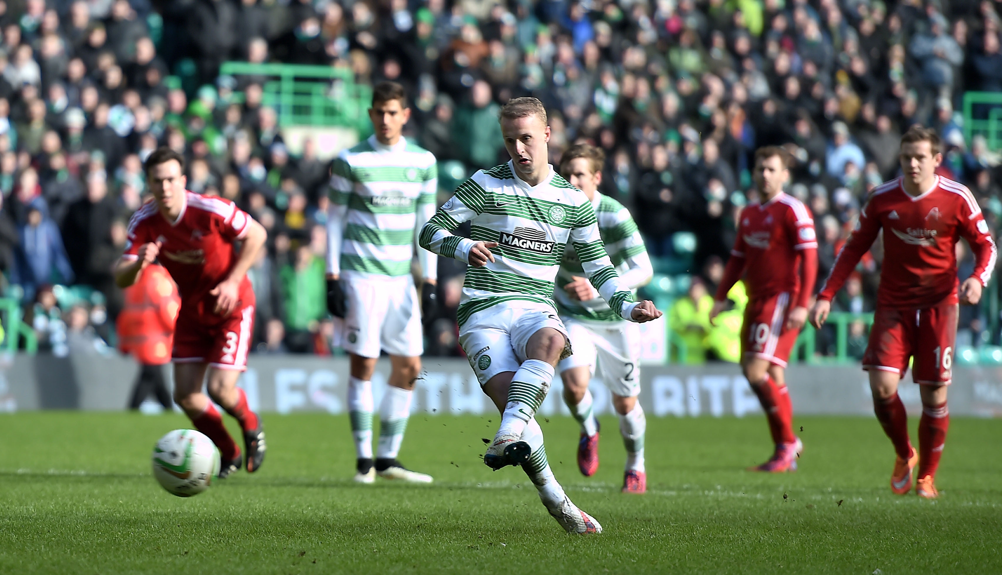 Leigh Griffiths strokes home Celtic's second goal, from the penalty spot. 