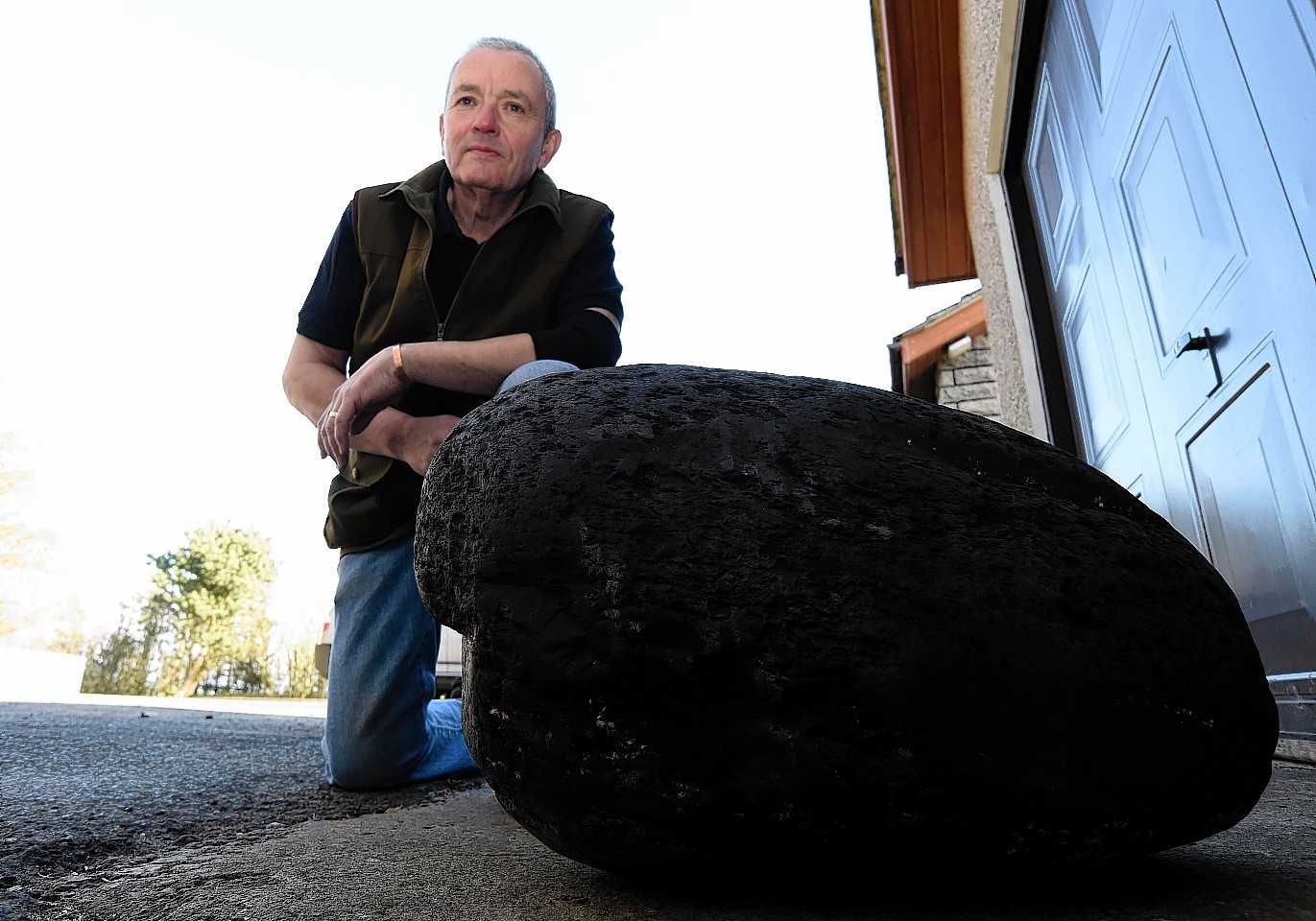 Ian Tait with the massive chunk of coal