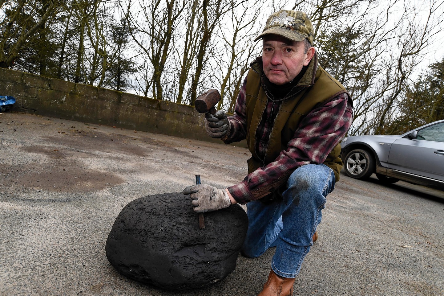 Ian Tait has chipped a piece of the coal to send for tests