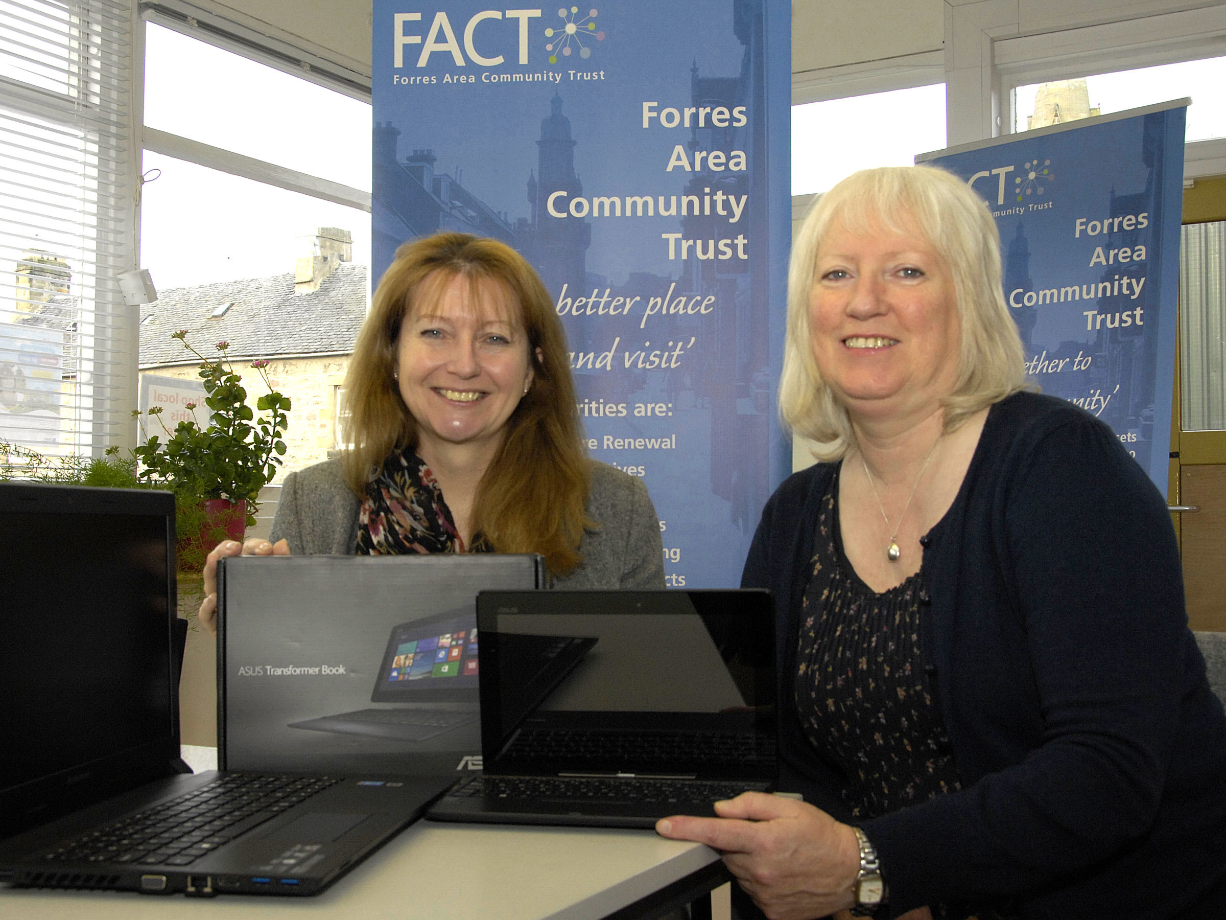 Rosemary Pannell (L) of the Moray Council, Presents I.T equipment to Frances Powell (R) Development Officer for the Forres Area Community Trust
