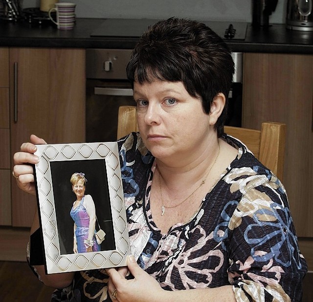 Michelle Bolt with a photograph of her mother, Gwen