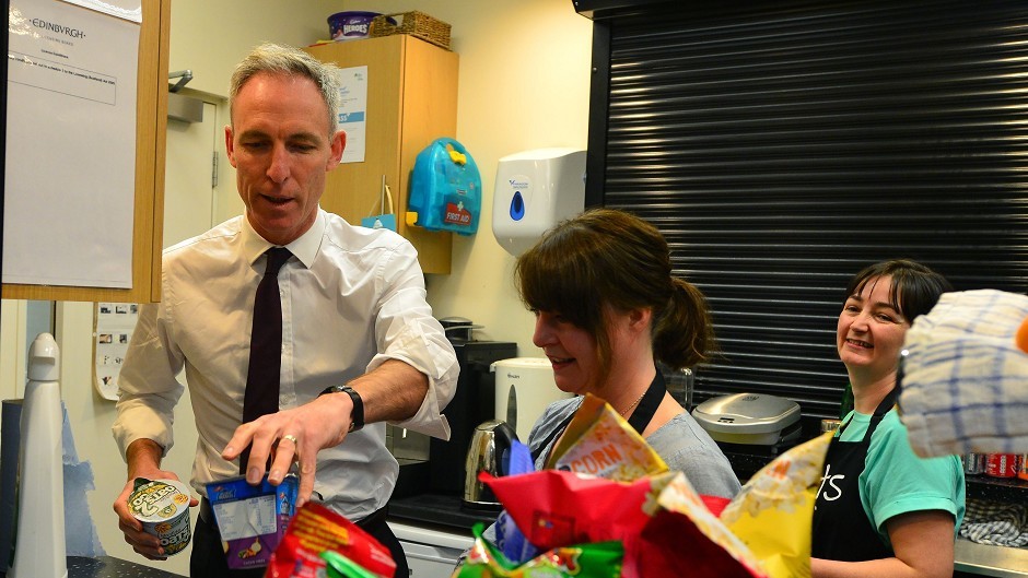 Scottish Labour party leader Jim Murphy prepares a kettle box food parcel