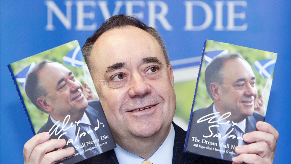 Former First Minister Alex Salmond with his new book The Dream Shall Never Die during a signing in Glasgow