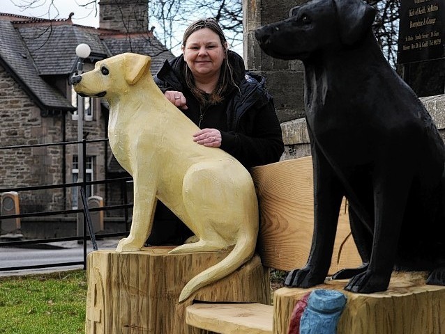 Community Councillor, Sadie Ogg, beside the bench