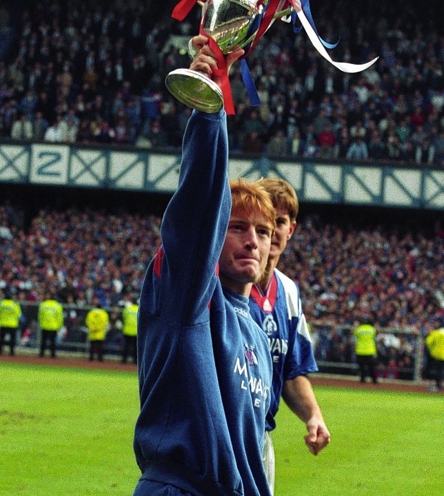 Stuart McCall parades the Premier Division championship trophy at the end of the 92/93 season.