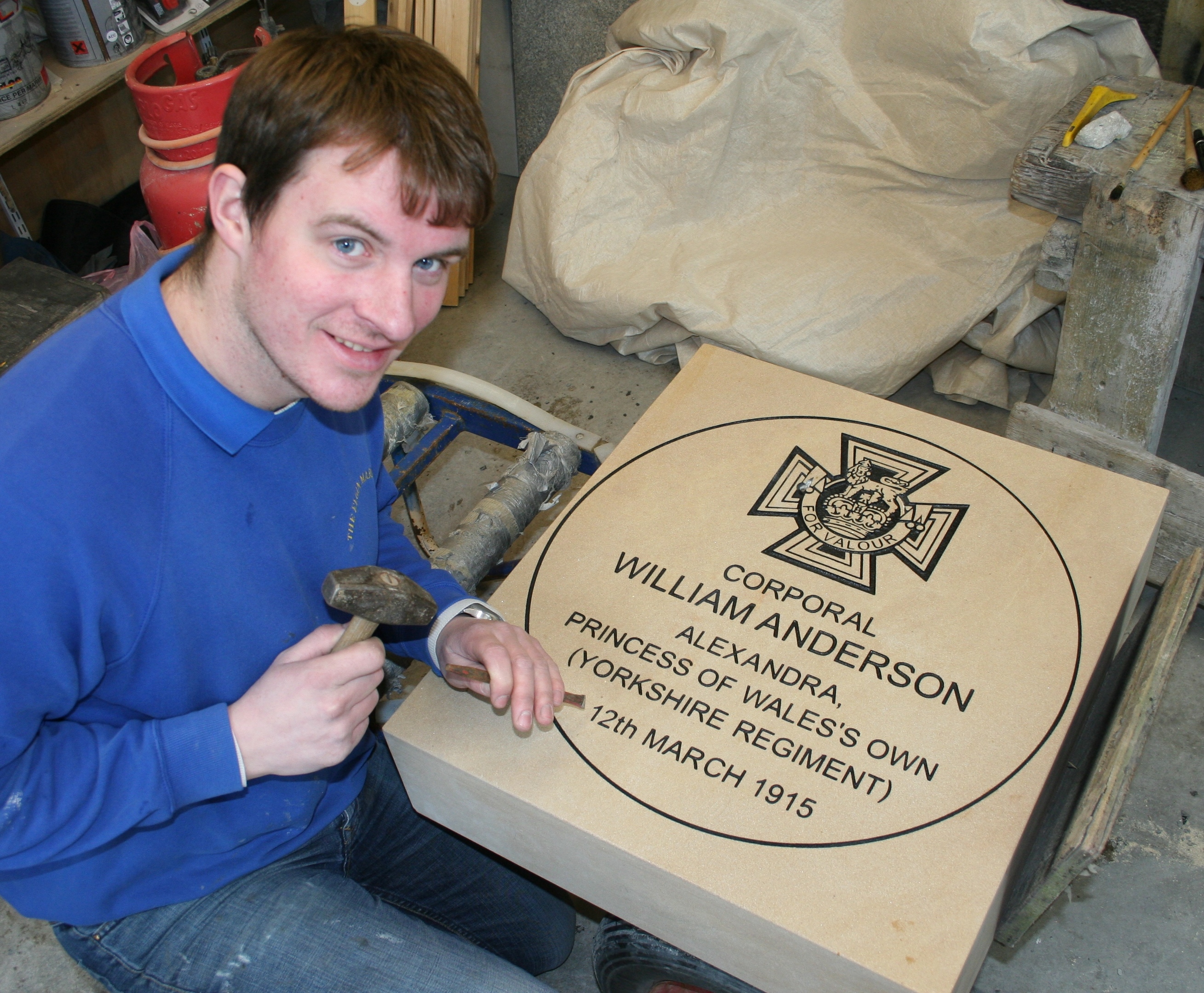 The stone being inscribed by John Ross, a fourth-generation employee of the family firm J.R. Henderson and Sons of Elgin.