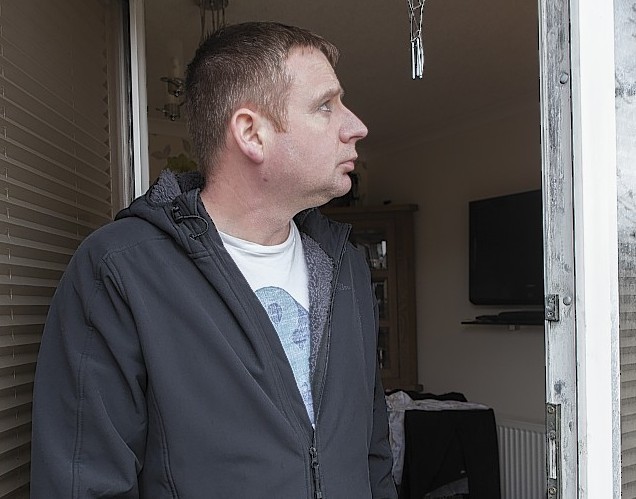 Donald Shearer looks at the damage to their home in Wick after the thieves broke in