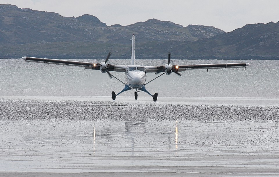 A plane lands at Barra Airport