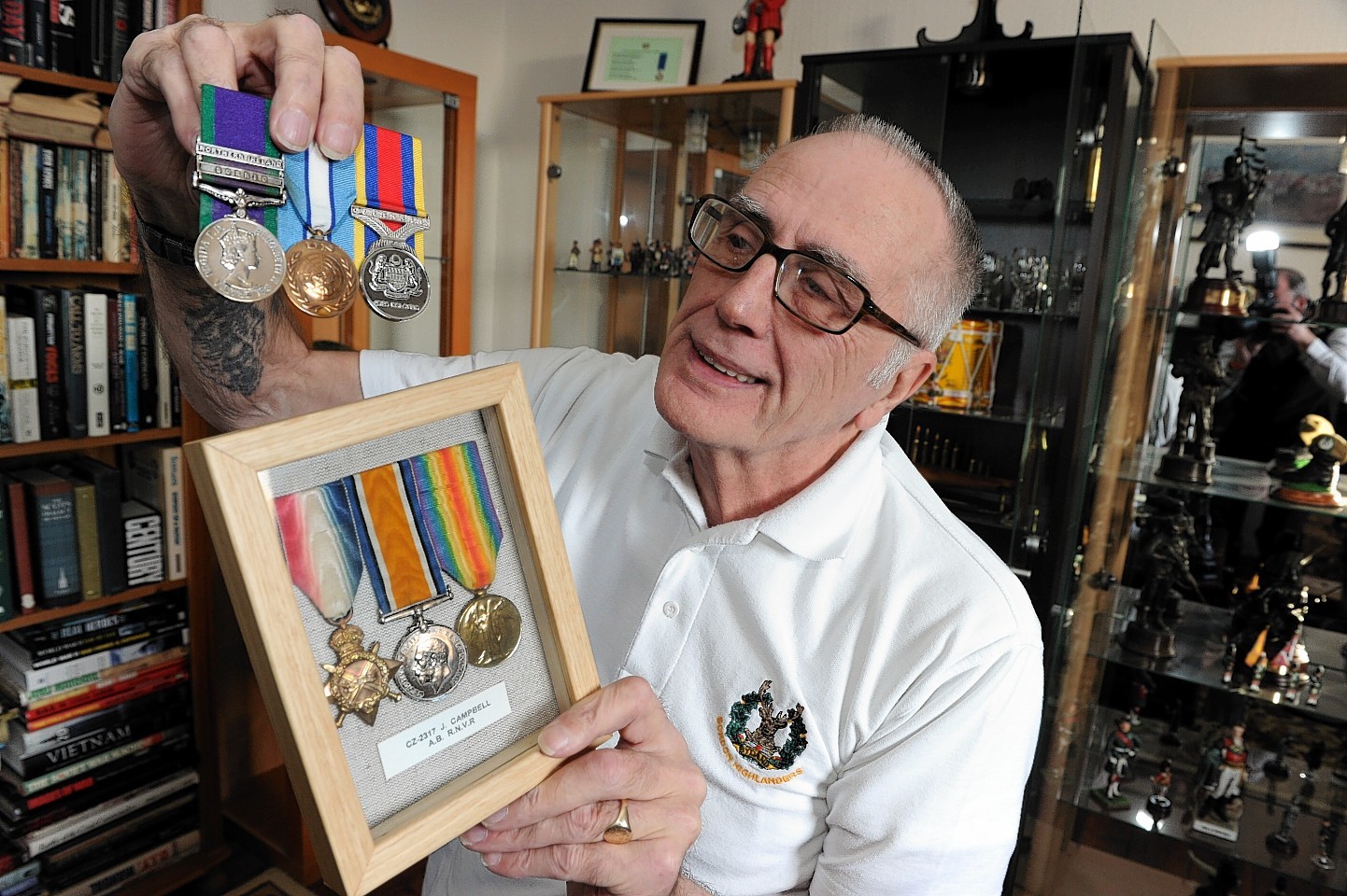 Gordon Highlander George Campbell at his home in Old Rayne with  his medals