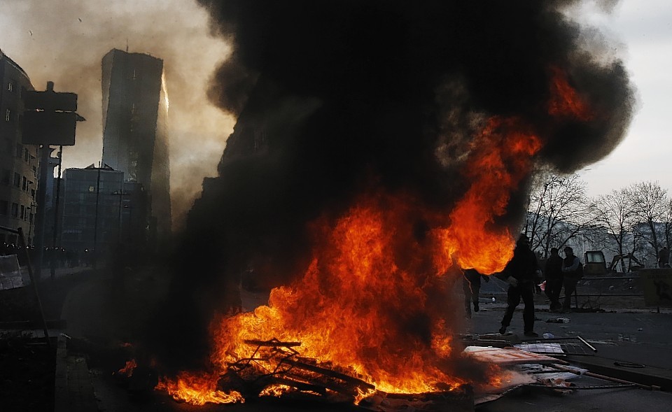 Barricades burn in front of the new ECB headquarters 