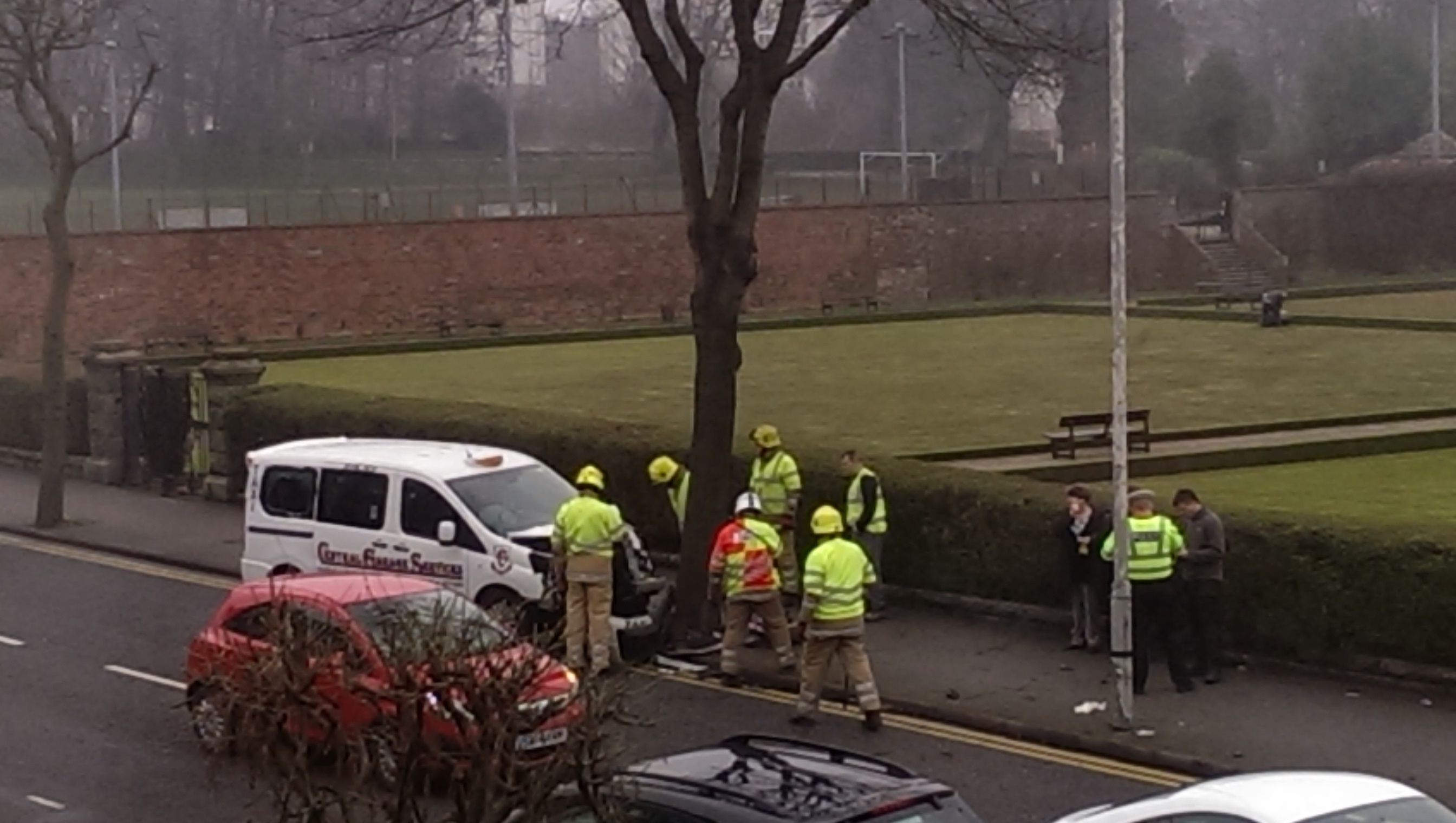 A taxi has crashed into a tree on a busy Aberdeen road