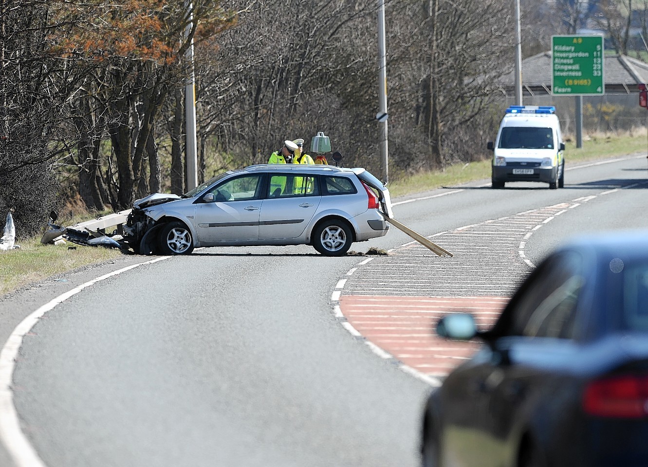 Police at the scene of this morning's crash on the A9