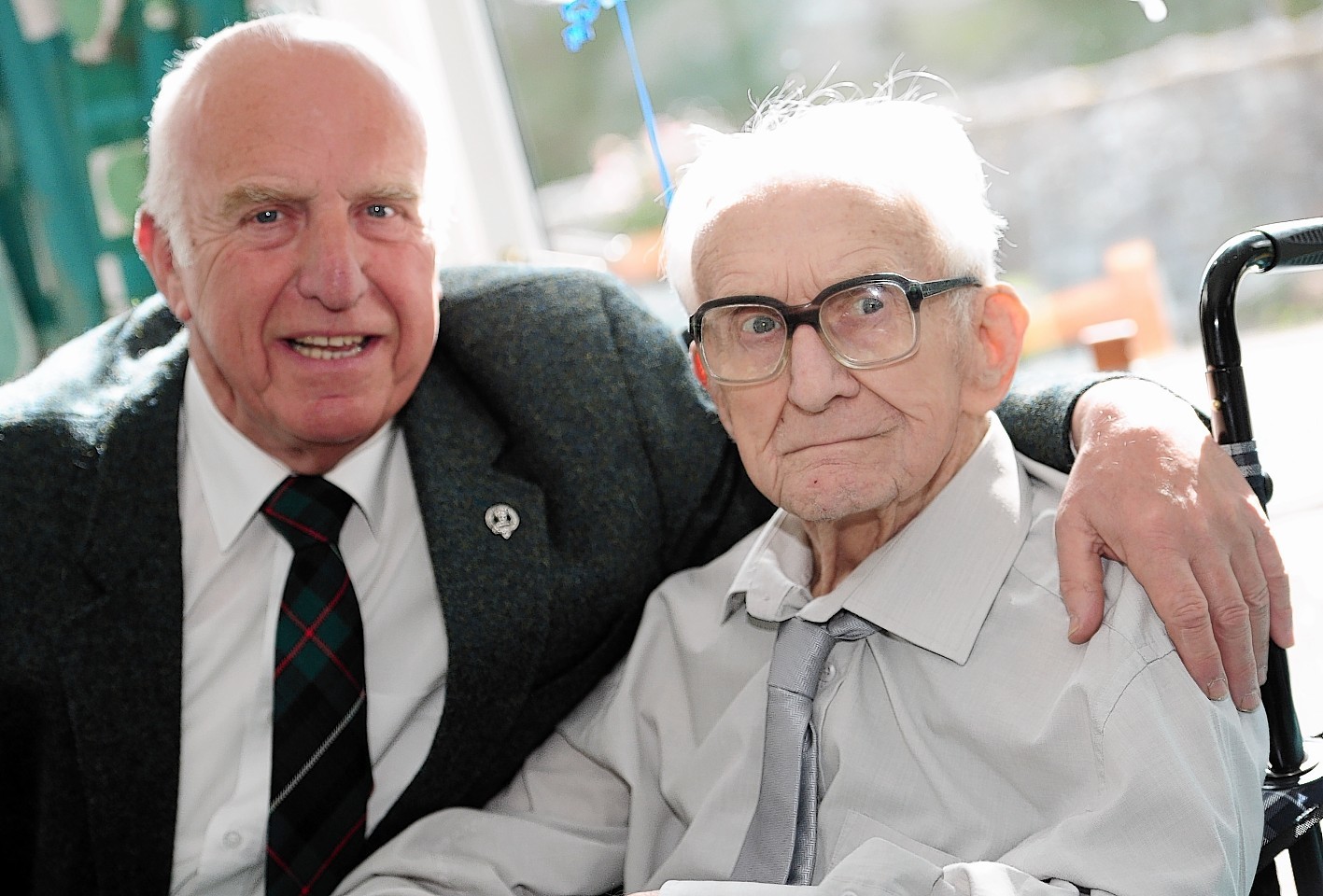 Former Gordon Highlander and Aberdeen Journals employee Arthur Robertson celebrates his 100th birthday 
with his son Gordon