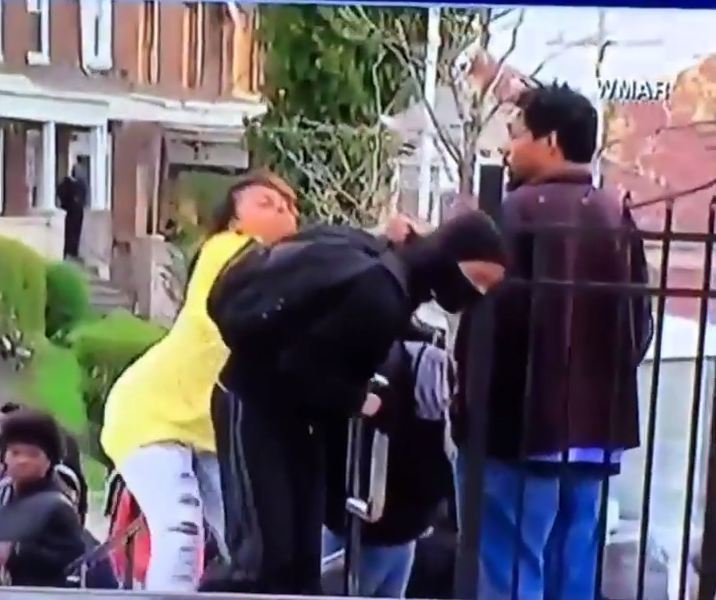 The mother in Baltimore drags her son clear