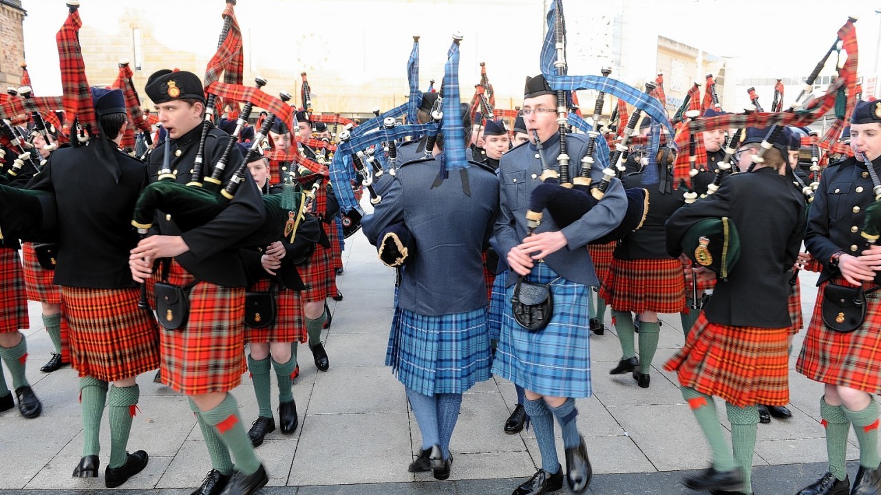 Around 100 pipers and drummers marched in Falcon Square