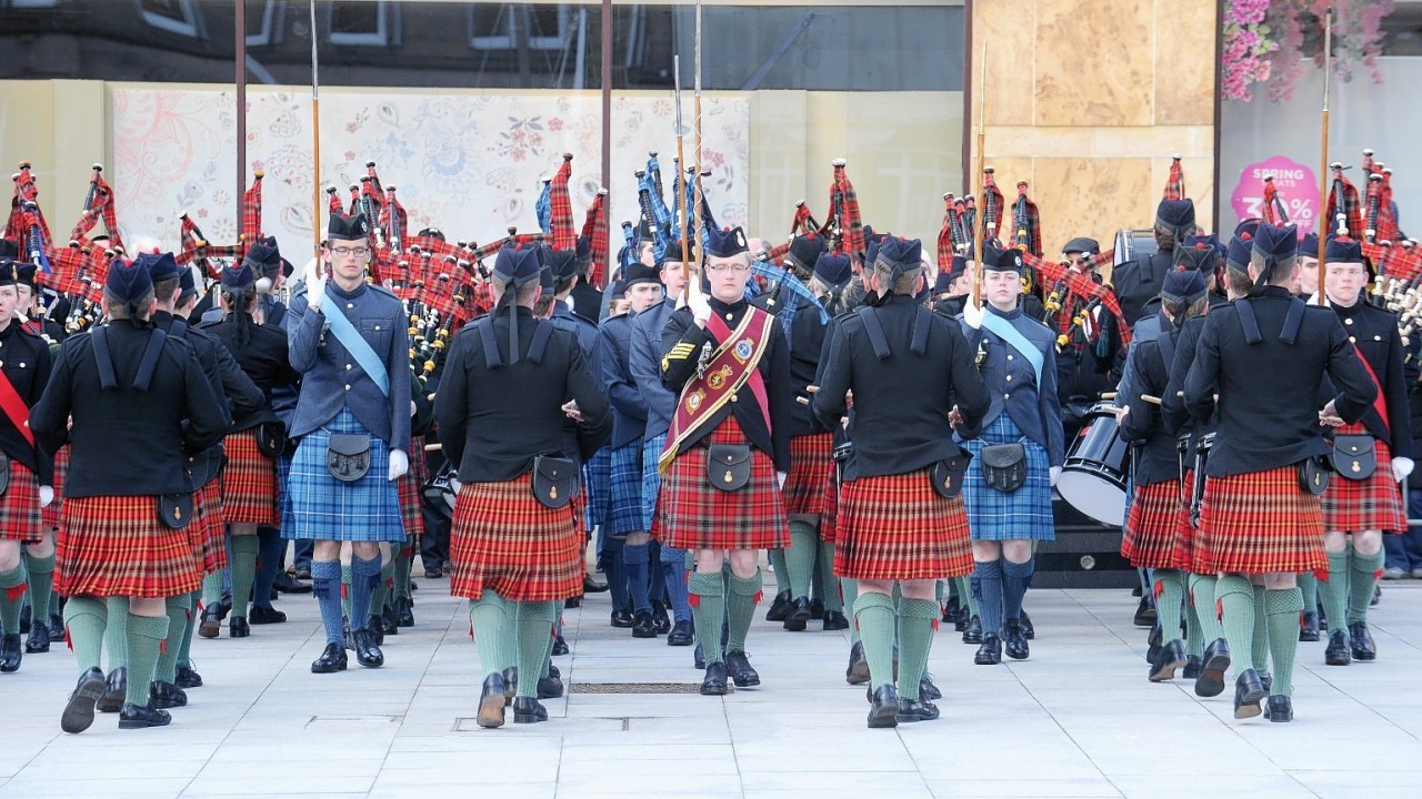 Around 100 pipers and drummers marched in Falcon Square