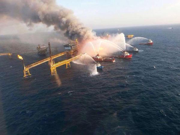 Emergency crews battle the oil rig fire in the Gulf of Mexico