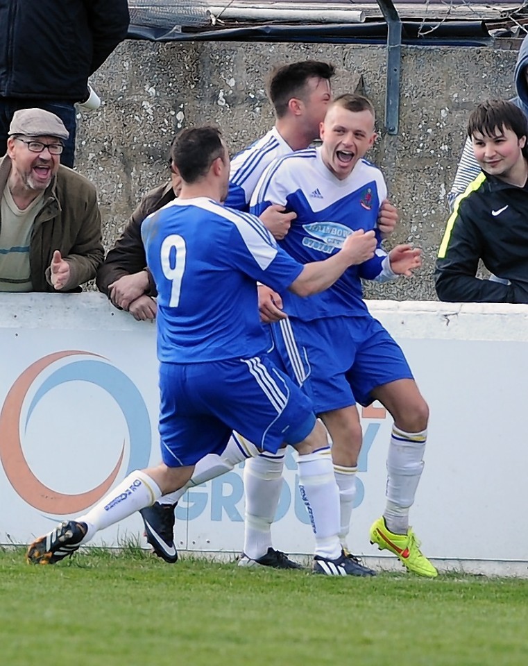 Cove celebrate netting the opening goal from the penalty spot.