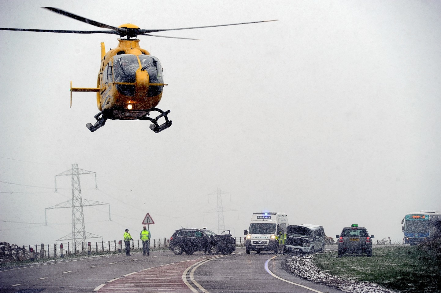 The air ambulance approaches the crash. Picture by Kenny Elrick.