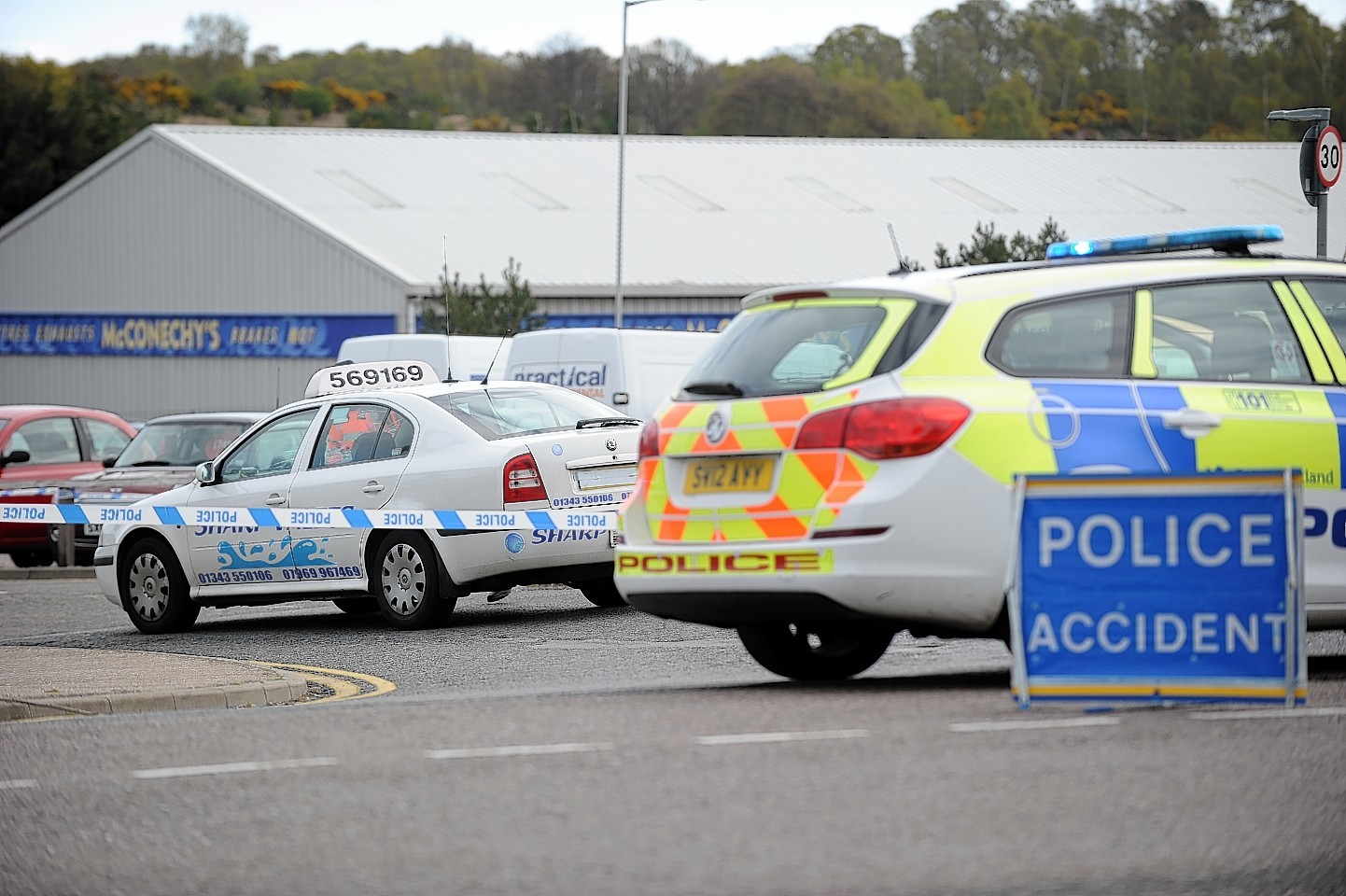 Police investigators at the scene of the accident