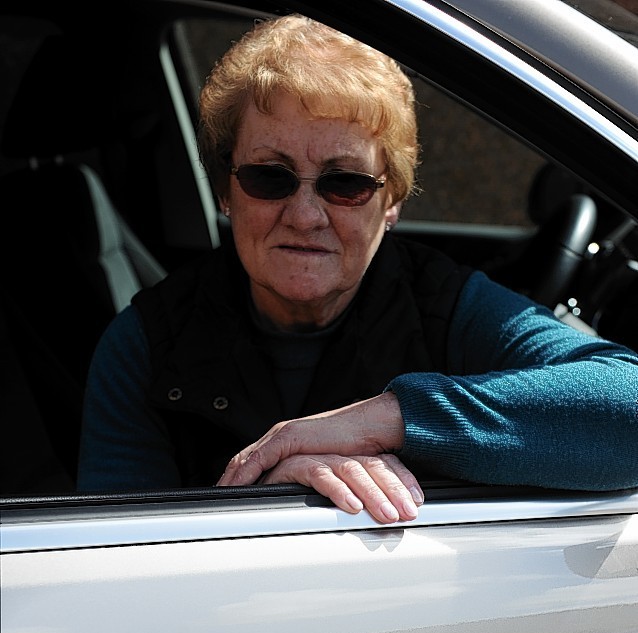 Gladys Simpson, with her mobility VW Tiguan, with the vandalised scratch on the driver's door. Picture by Gordon Lennox