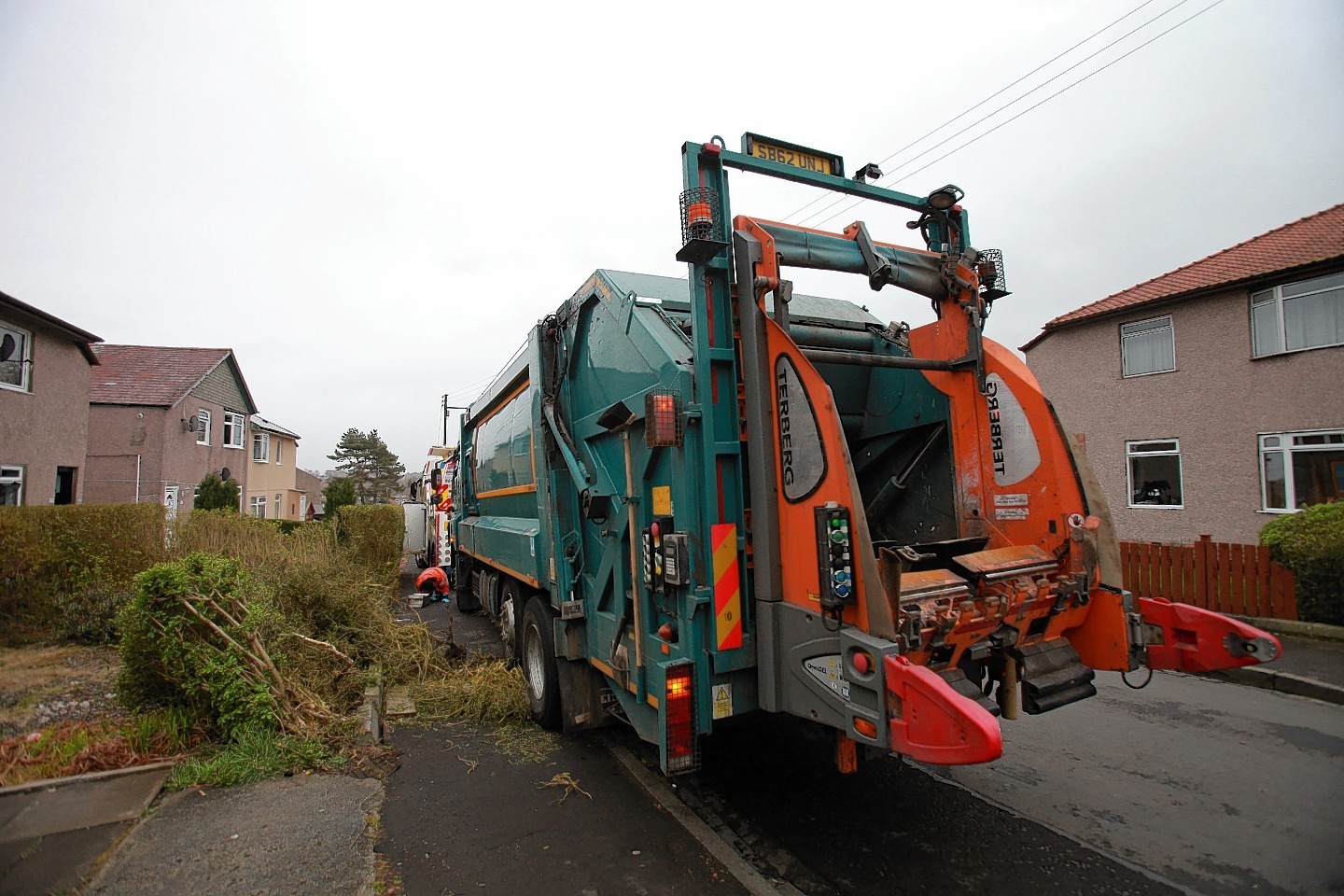 A bin lorry that had crashed into a front garden on Croftside Avenue in southside of Glasgow after it is believed the driver took unwell at the wheel.