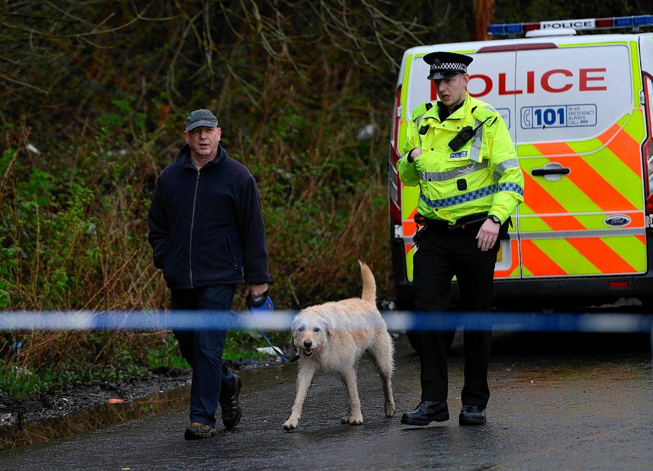 Police continue to search Dawsholm Park, Glasgow, April 15, 2015, where police say the hand bag of missing Irish student Karen Buckley, 24, was found