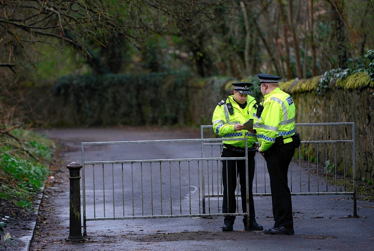 Police continue to search Dawsholm Park, Glasgow, April 15, 2015, where police say the hand bag of missing Irish student Karen Buckley, 24, was found